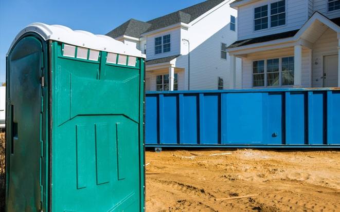 dumpster and portable toilet at a construction site project in Roswell GA